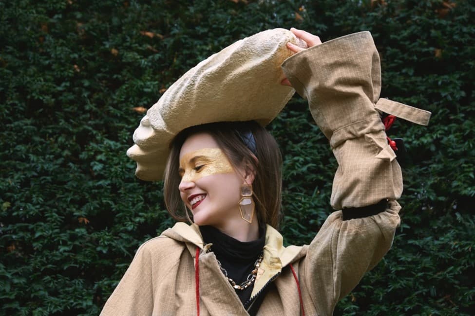 Model wears mushroom hat